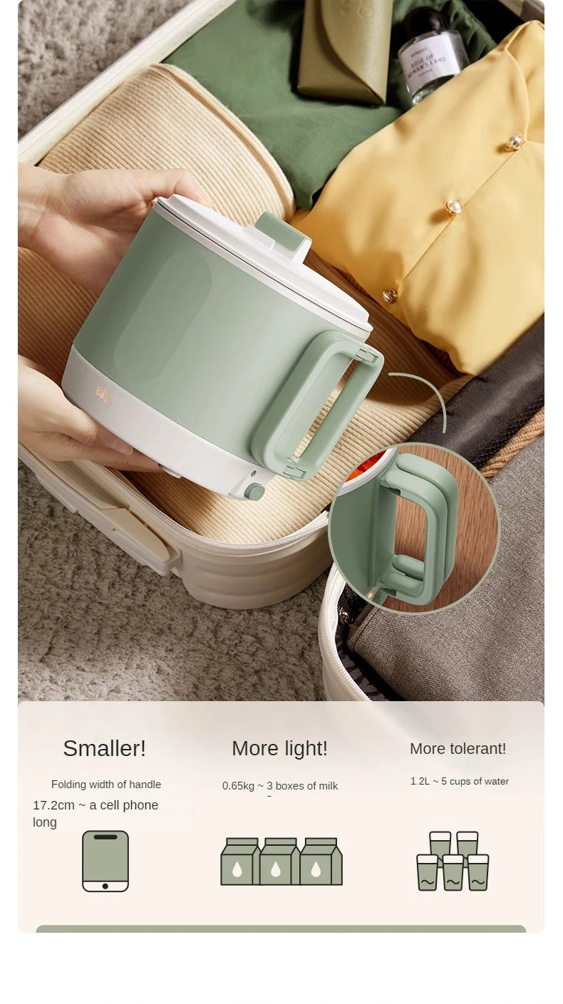 Mint green electric hot pot with white lid and side handle, portable countertop cooker