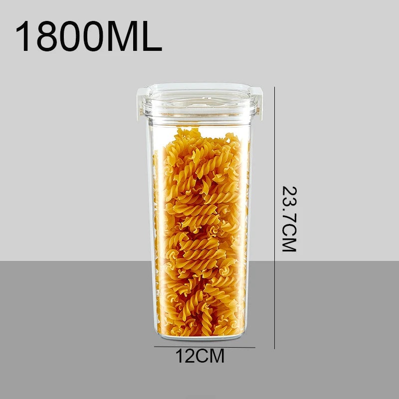 Clear vacuum jar with airtight lid filled with yellow spiral pasta