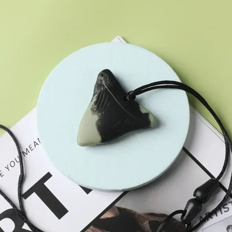 Black and grey triangle silicone teething toy pendant for baby teething relief.