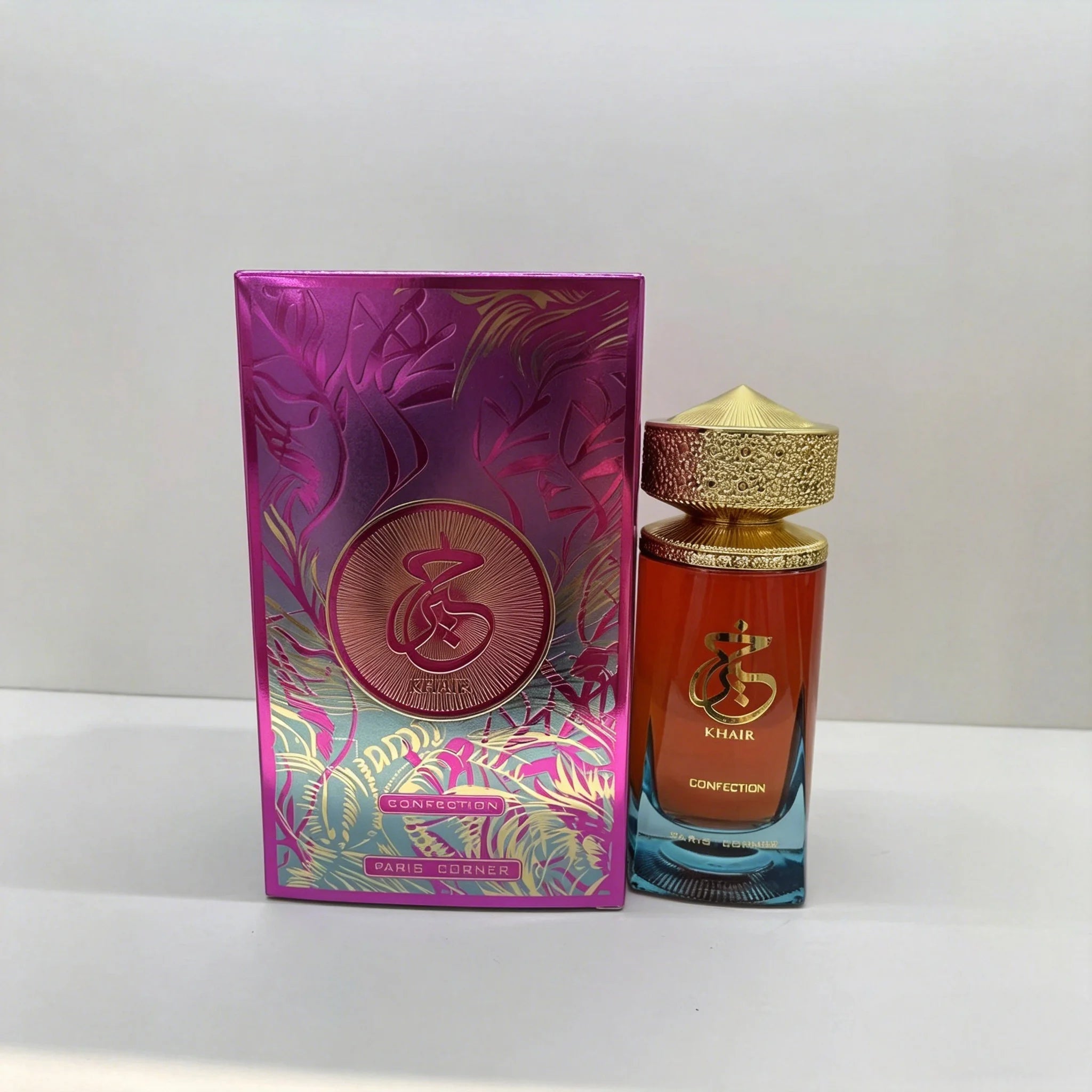 Paris Corner Khair Confection EDP: 100ml Arabian unisex perfume in an ornate gold-capped glass bottle with pink box.