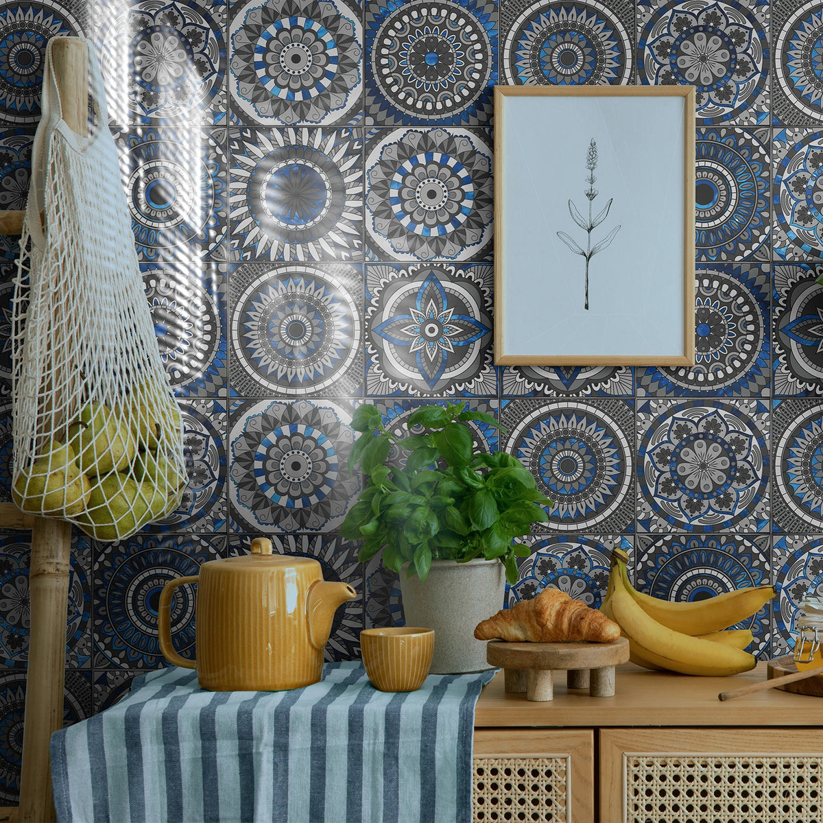 Blue and white circular mandala tile-style wallpaper covering the kitchen wall