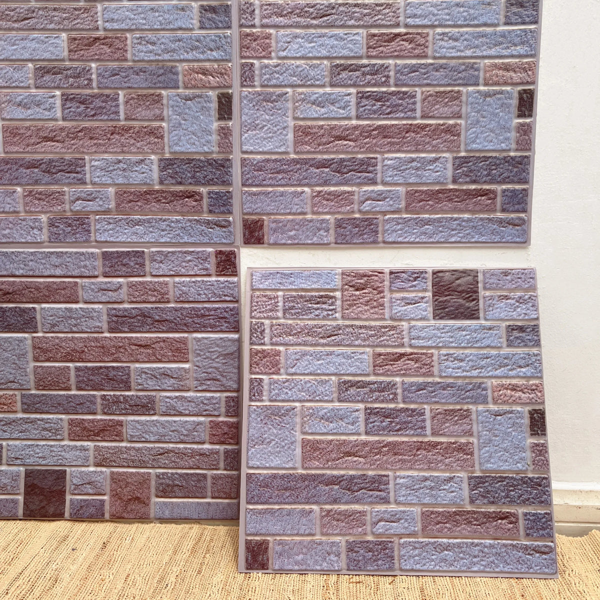 Peel-and-stick brick tile backsplash, lavender and burgundy stacked-stone pattern