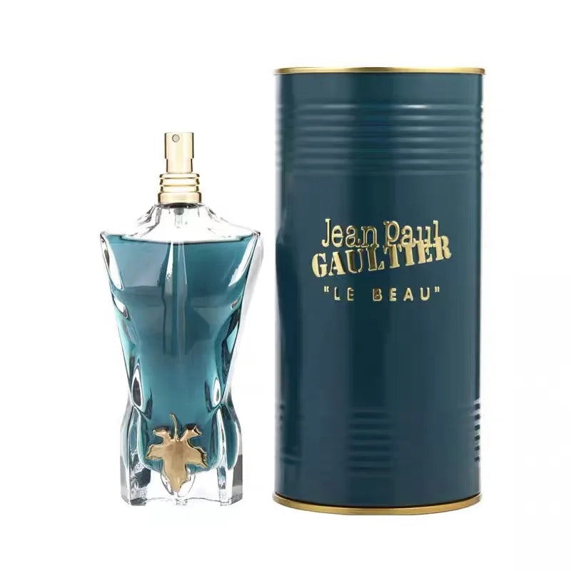 Jean Paul Gaultier Le Beau Le Parfum for men: torso-shaped bottle with gold leaf, EDP intense fragrance in tin can.