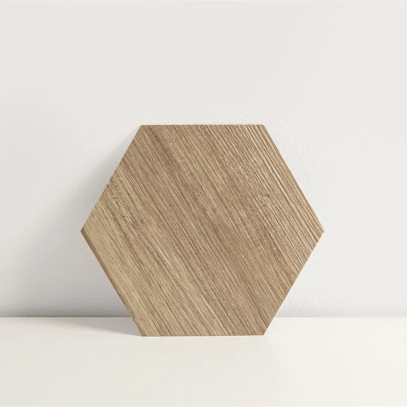 Hexagon wood-grain vinyl peel-and-stick tile, single natural tan hex with wood texture.