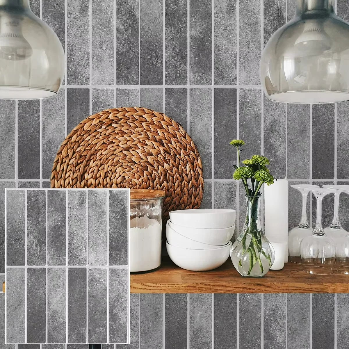 Grey peel-and-stick backsplash tile sheet with textured subway tile pattern, close-up on counter
