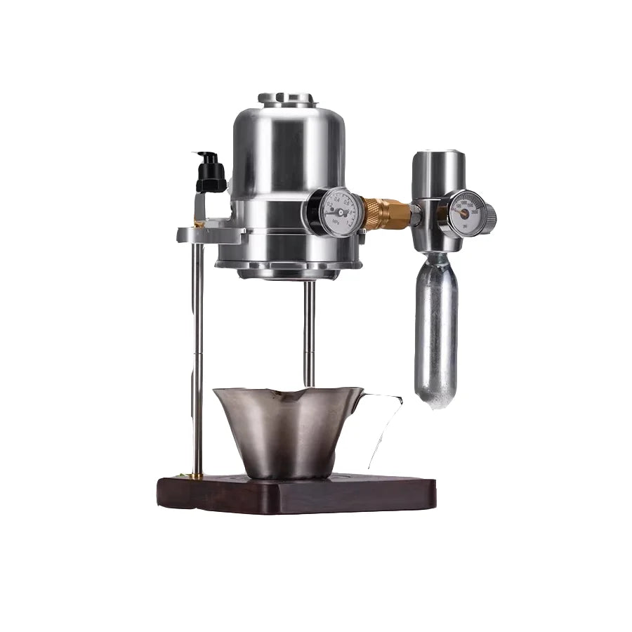 Stainless steel manual espresso maker with pressure gauge and CO2 charger on a wooden base.
