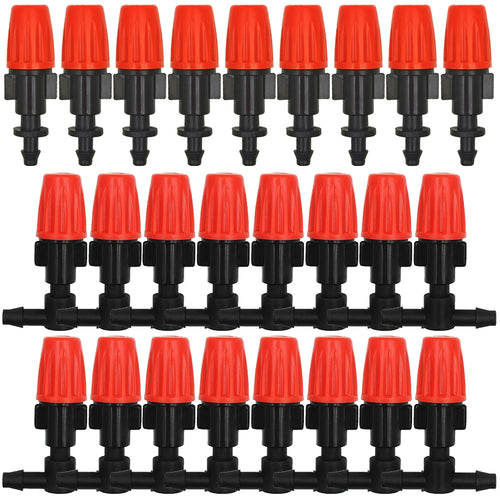 Set of orange drip irrigation nozzle drippers with black fittings on a hose manifold