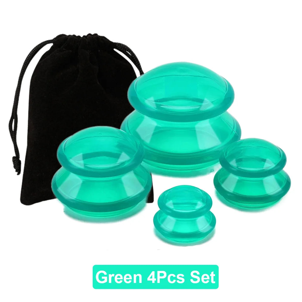 A set of four translucent green silicone massage cupping jars in varying sizes with a black storage bag.