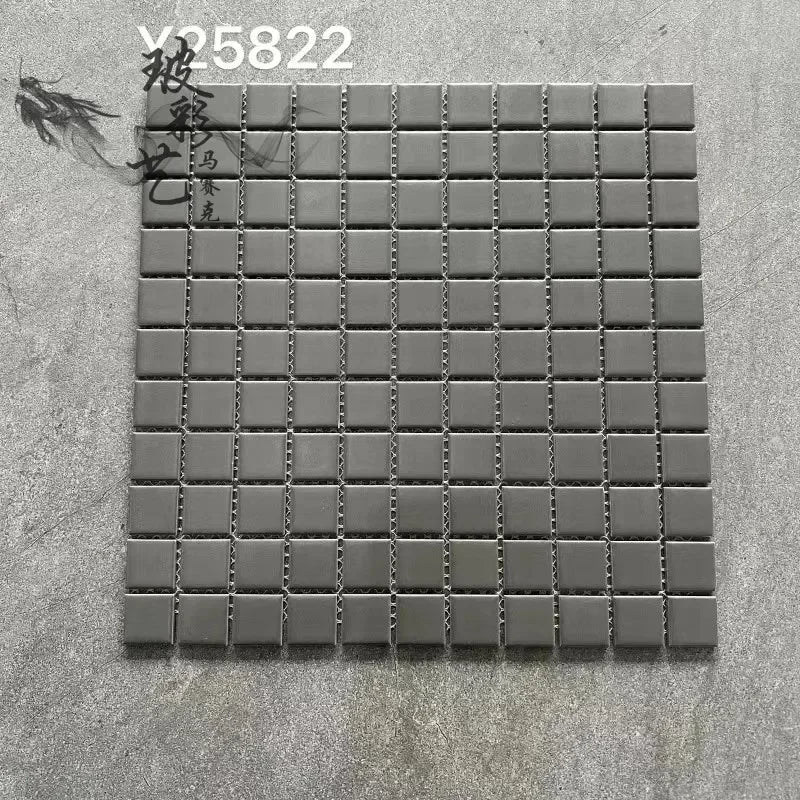 Medium gray ceramic mosaic tile sheet with glossy square grid and silver grout lines