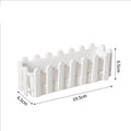 White rectangular planter with decorative fence pickets and arched top rail