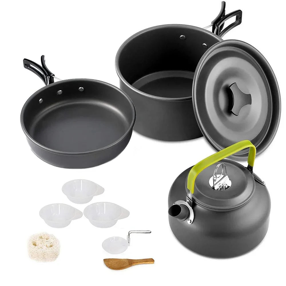 Nested aluminum camping cookware set with black skillet, pot lids, and kettle