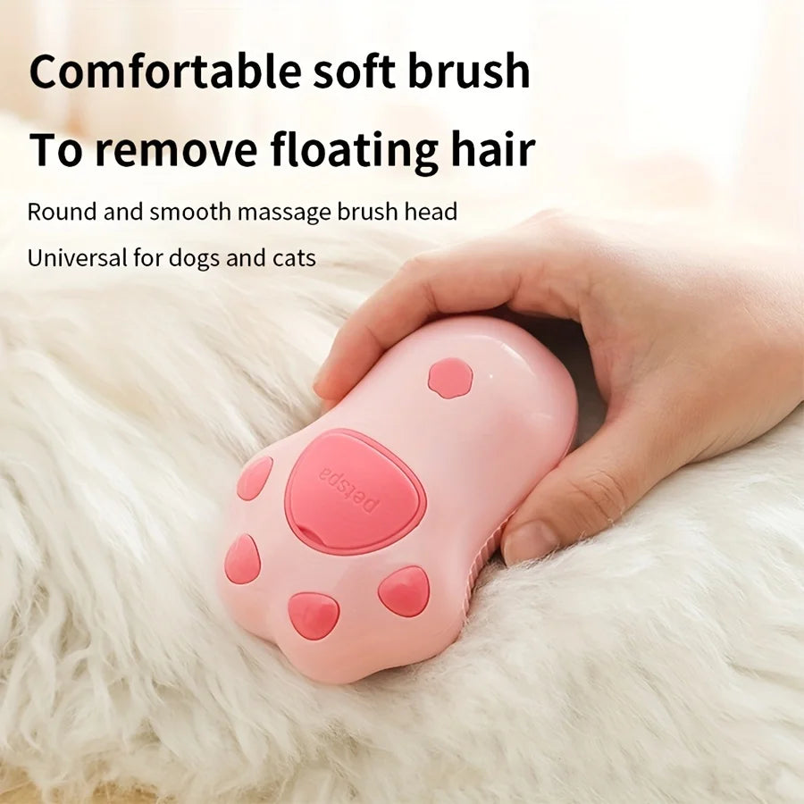 Pink 3-in-1 electric steam pet grooming brush for cats and dogs, removes hair with soft massage bristles.