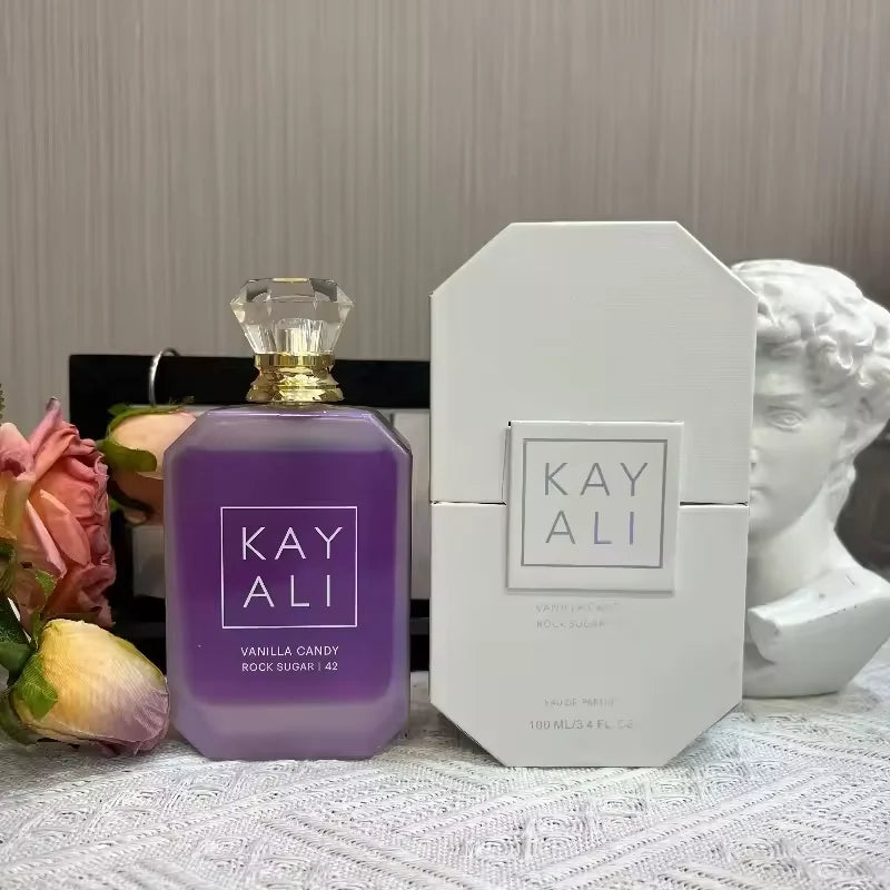 Kayali Vanilla Candy Rock Sugar 100ml EDP. Purple octagonal bottle, sweet floral woody gourmand women's luxury perfume.