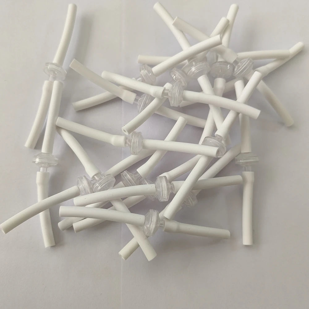 White disposable replacement connect tubes for Microneedle RF skin lifting machines with small clear filters.