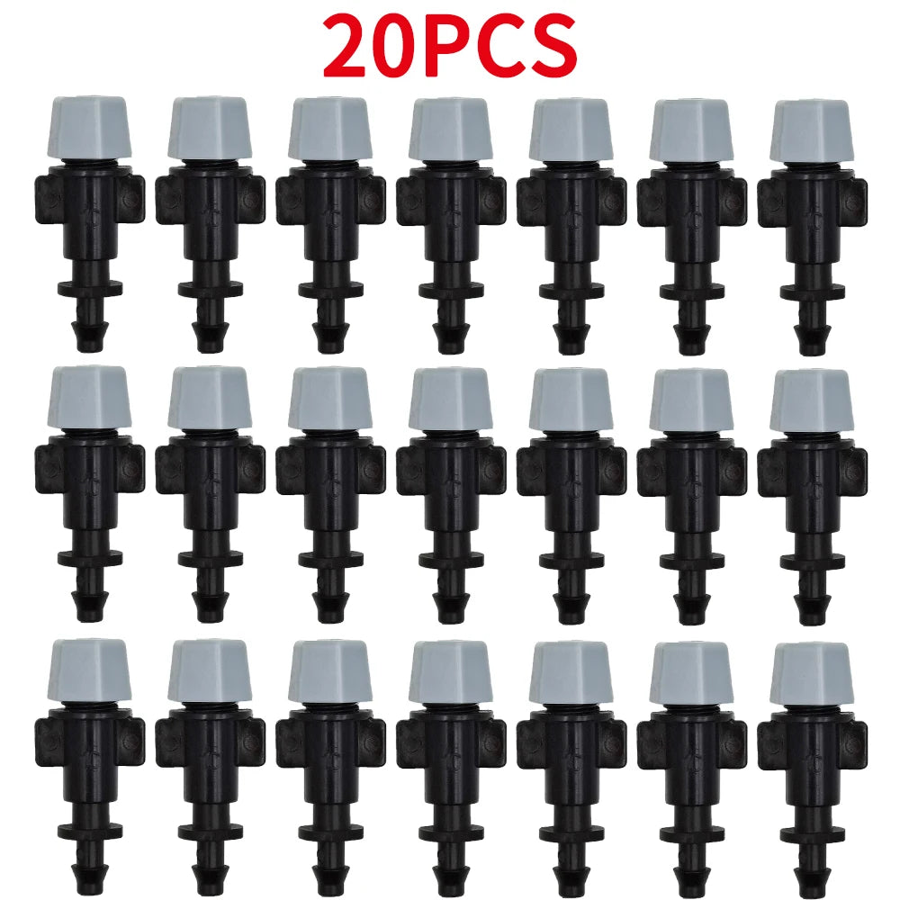 Set of white-cap drip nozzle drippers with black bases and multi-outlet stems
