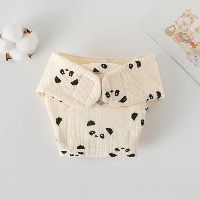 Cream muslin baby cloth diaper with black panda print and adjustable Velcro closure. Soft eco-friendly baby care.
