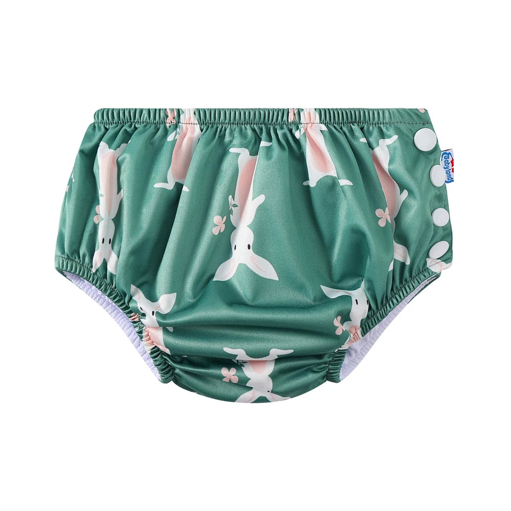 Babyland reusable baby cloth diaper in green with white bunny rabbit print and adjustable side snaps.