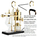 Gold royal balance siphon coffee maker with glass carafe and black base plate. Elegant manual coffee brewing system.