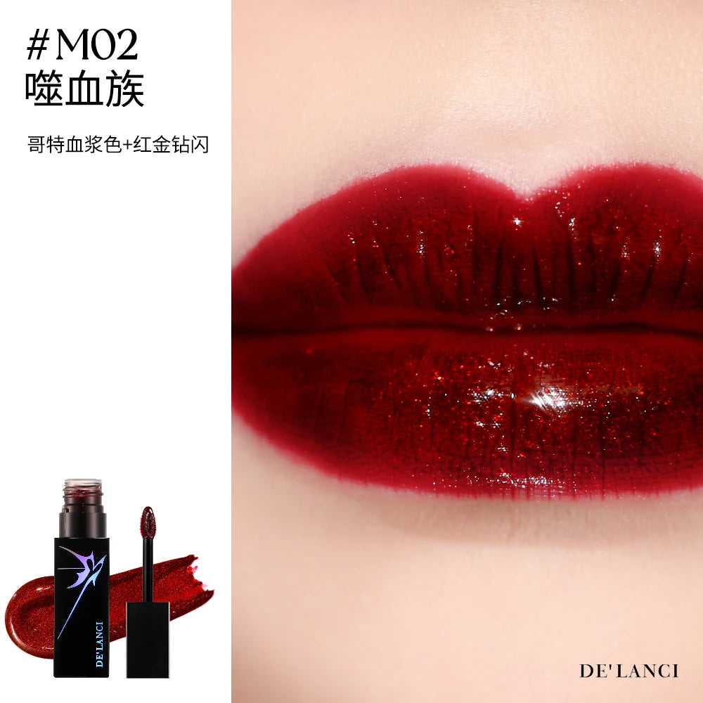 DE'LANCI Gothic dark red shimmer lip gloss with high-pigment, mirror-shine finish and sparkling glitter texture.