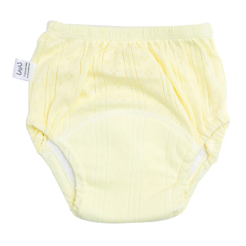 UoU yellow reusable baby training diaper, soft cotton fabric with absorbent layer for toddler potty training.