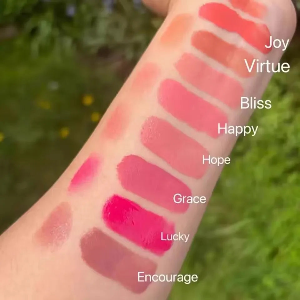 Rare Beauty matte lipstick swatches in rich colors with a smooth, fine texture on arm for a comfortable, natural finish.