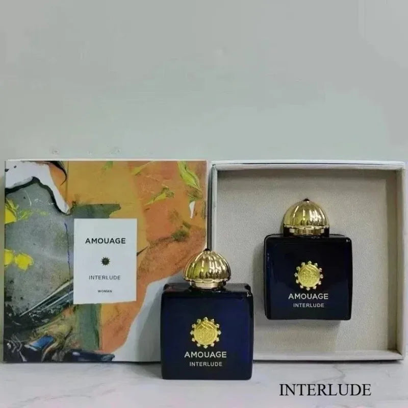 Amouage Interlude Women’s Eau de Parfum set in dark blue glass bottles with gold caps and decorative gift packaging.