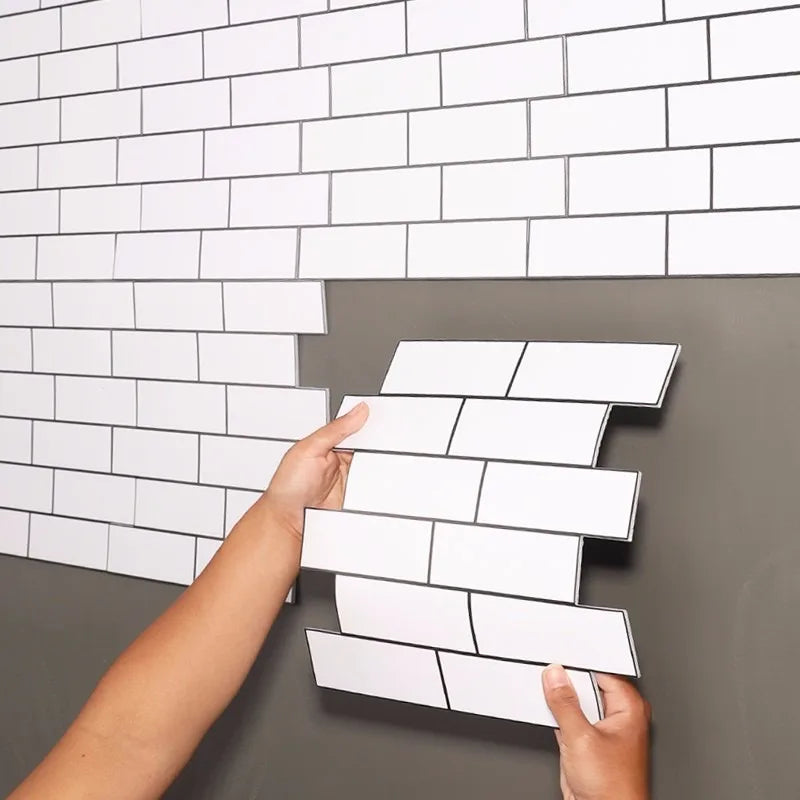 Peel-and-stick white subway backsplash tiles with staggered brick layout