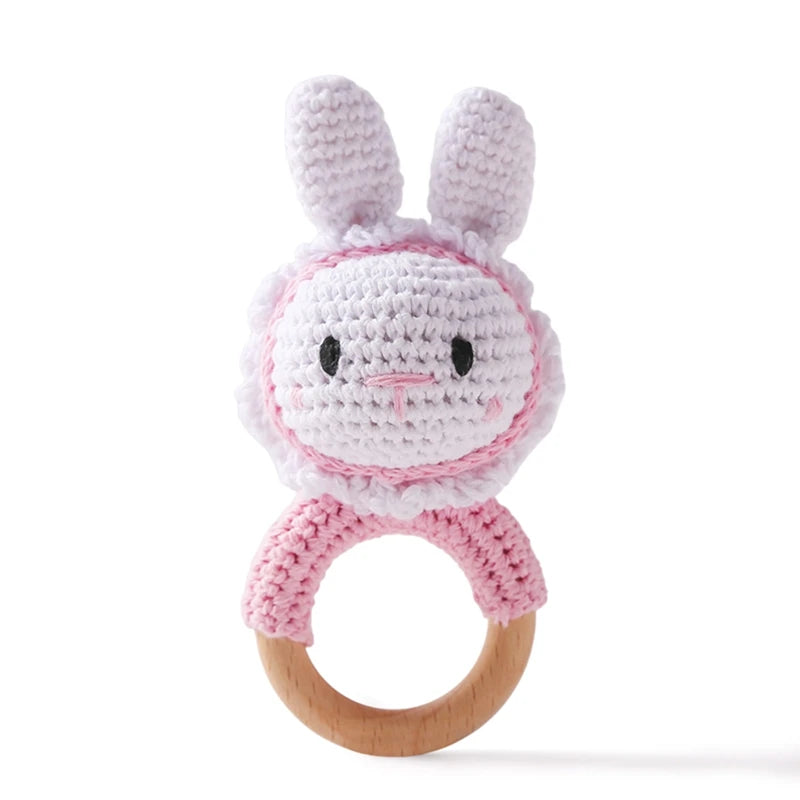 Pink and white bunny baby teething ring made of soft cotton and natural wood.