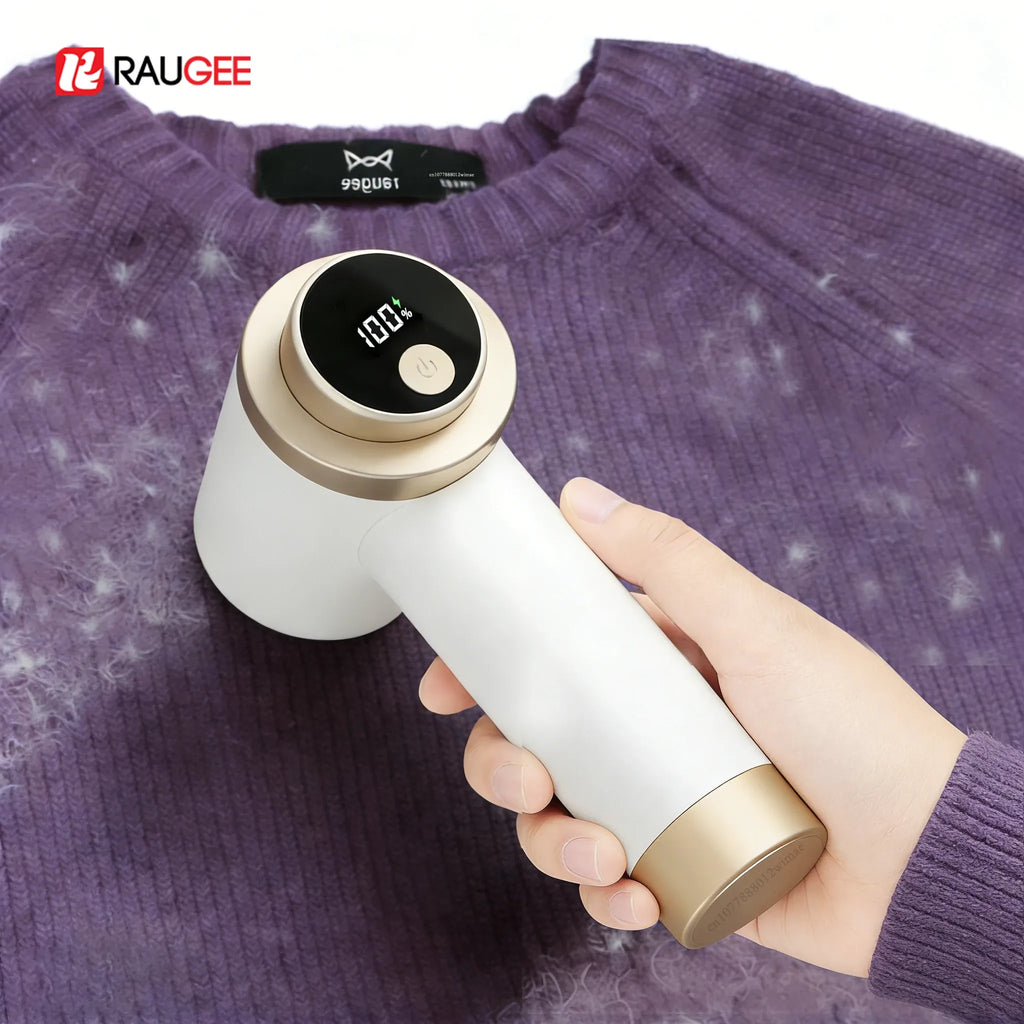 Fabric shaver lint remover with digital battery display removing fuzz from a purple wool sweater.