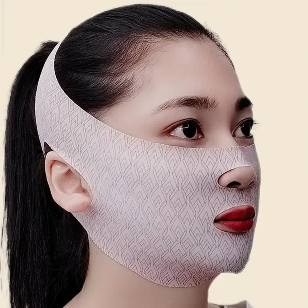A person wears a beige V-line lifting face mask with a geometric pattern, covering the chin and jawline.