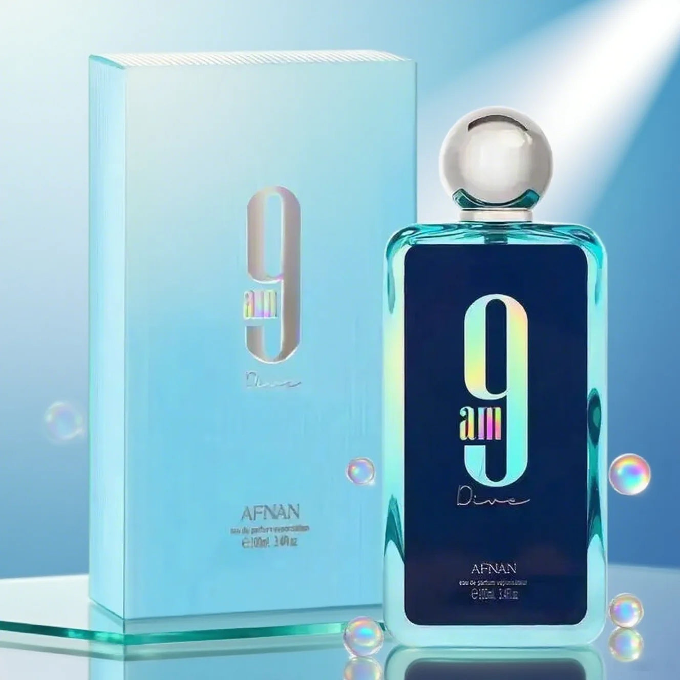 9 AM Dive eau de parfum, 100ml. Rectangular glass bottle with blue gradient, dark label, and silver spherical cap.