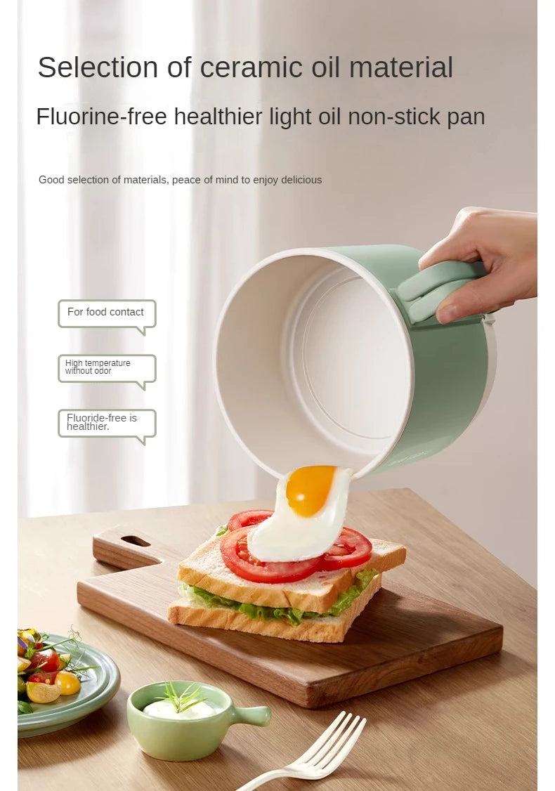 Mint green electric hot pot with nonstick interior, pouring food onto toast on board