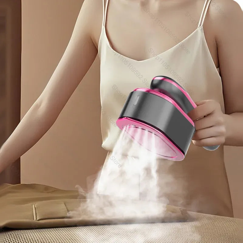 Handheld garment steamer releasing steam to smooth wrinkles on clothing on a table.