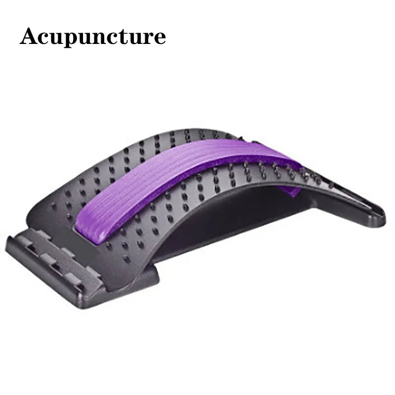 Black arched back stretcher with a purple foam center strip and acupressure massage nubs for lumbar pain relief.