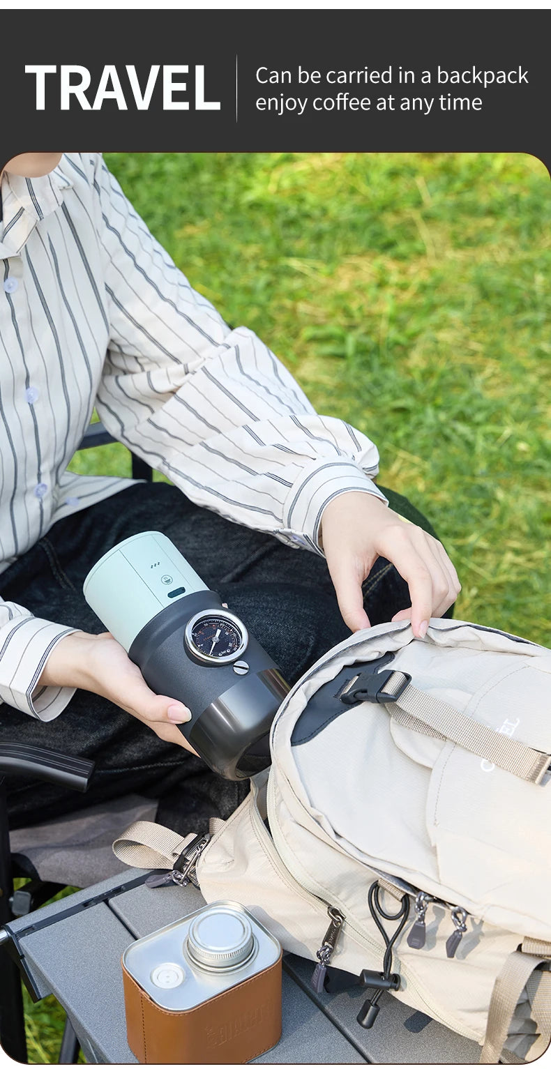 Portable mint green and black manual coffee maker with built-in pressure gauge being packed into a travel backpack.