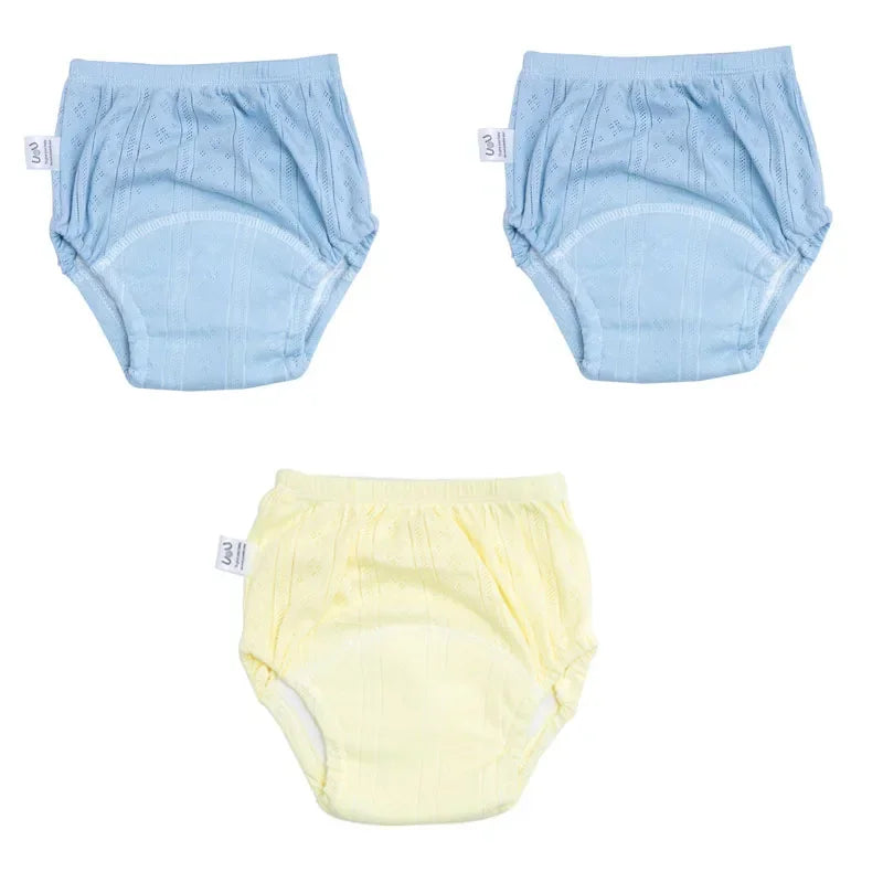 Set of 3 U&U baby training diapers in pastel blue and yellow, featuring absorbent cotton fabric for potty training.