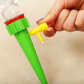 Green adjustable drip irrigation stake with yellow valve tip and red cap, 10-pack