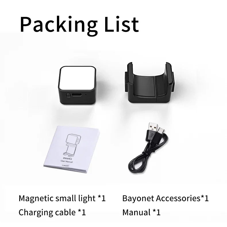 Magnetic light kit including a small square light, black plastic mount, USB charging cable, and user manual.