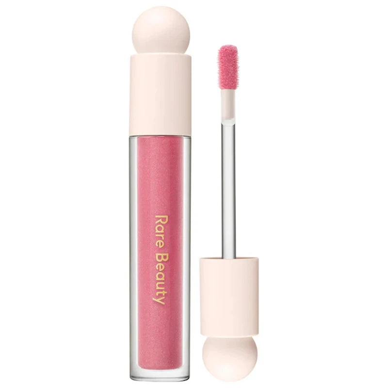 Rare Beauty Soft Pinch Tinted Lip Oil in a pink shade with a doe-foot applicator, featuring a moisturizing, glossy finish.