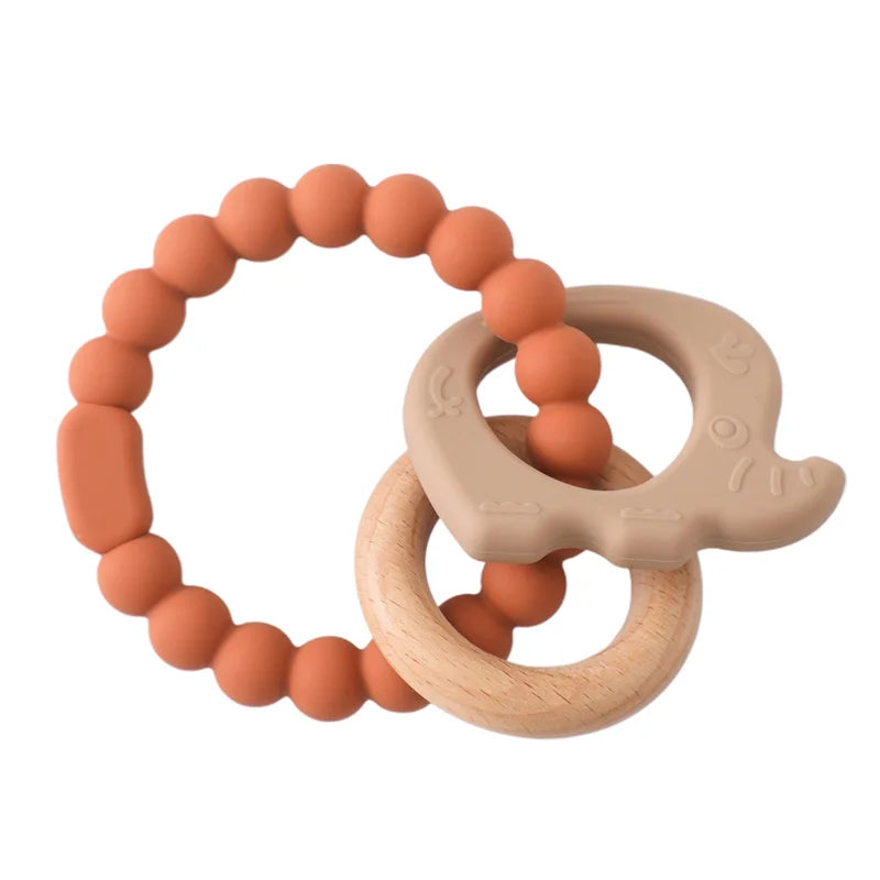 Rust and beige silicone and natural wood baby teething ring toy for infant pain relief.