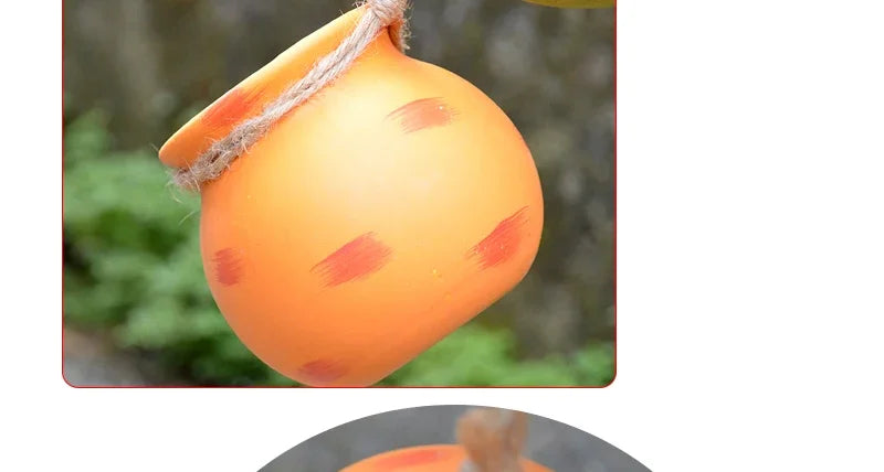 Hanging ceramic flowerpot vase with rope, orange with pink speckle marks