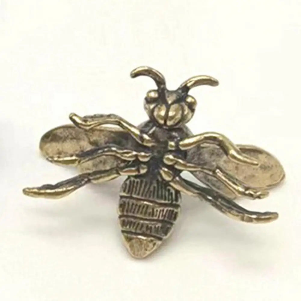 Small solid brass bee tea pet figurine, a detailed golden insect sculpture for desktop decoration or home decor.