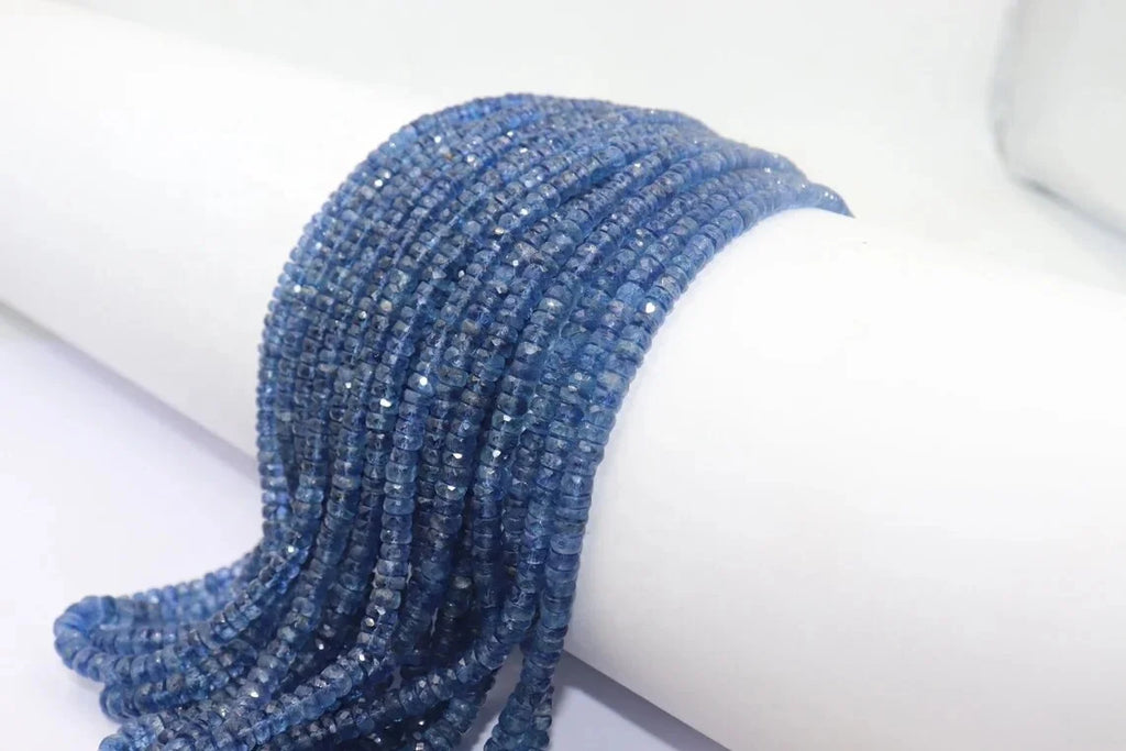 Curved kyanite rondelle bead strand in faceted blue rows, small drilled holes
