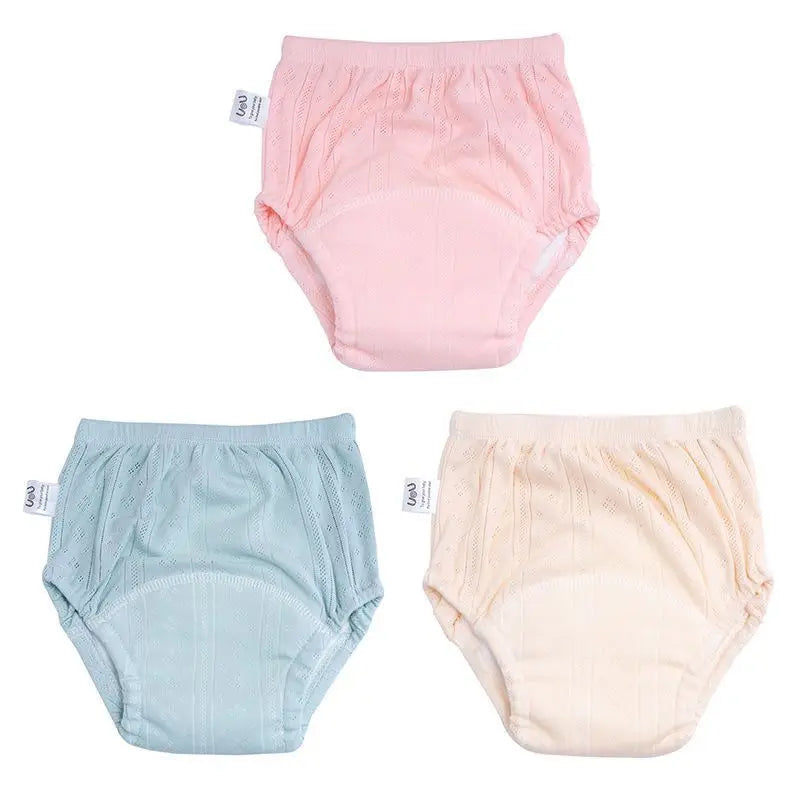 Set of 3 UeU baby training pants in pink, blue, and cream. Washable cotton reusable cloth diapers for toddlers.