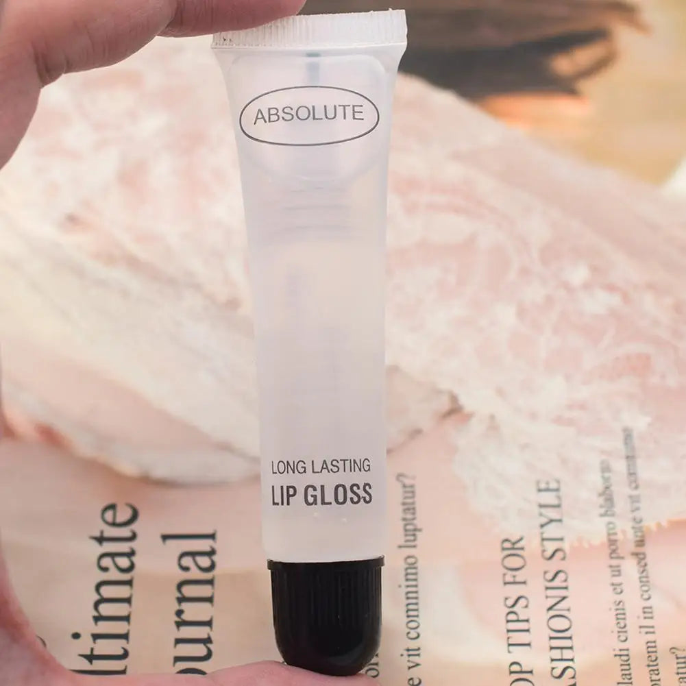 Clear Absolute long-lasting lip gloss in a squeeze tube for hydrating, smoothing, and plumping lip makeup.