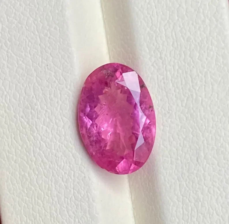 Oval-cut pink sapphire gemstone, loose natural faceted stone