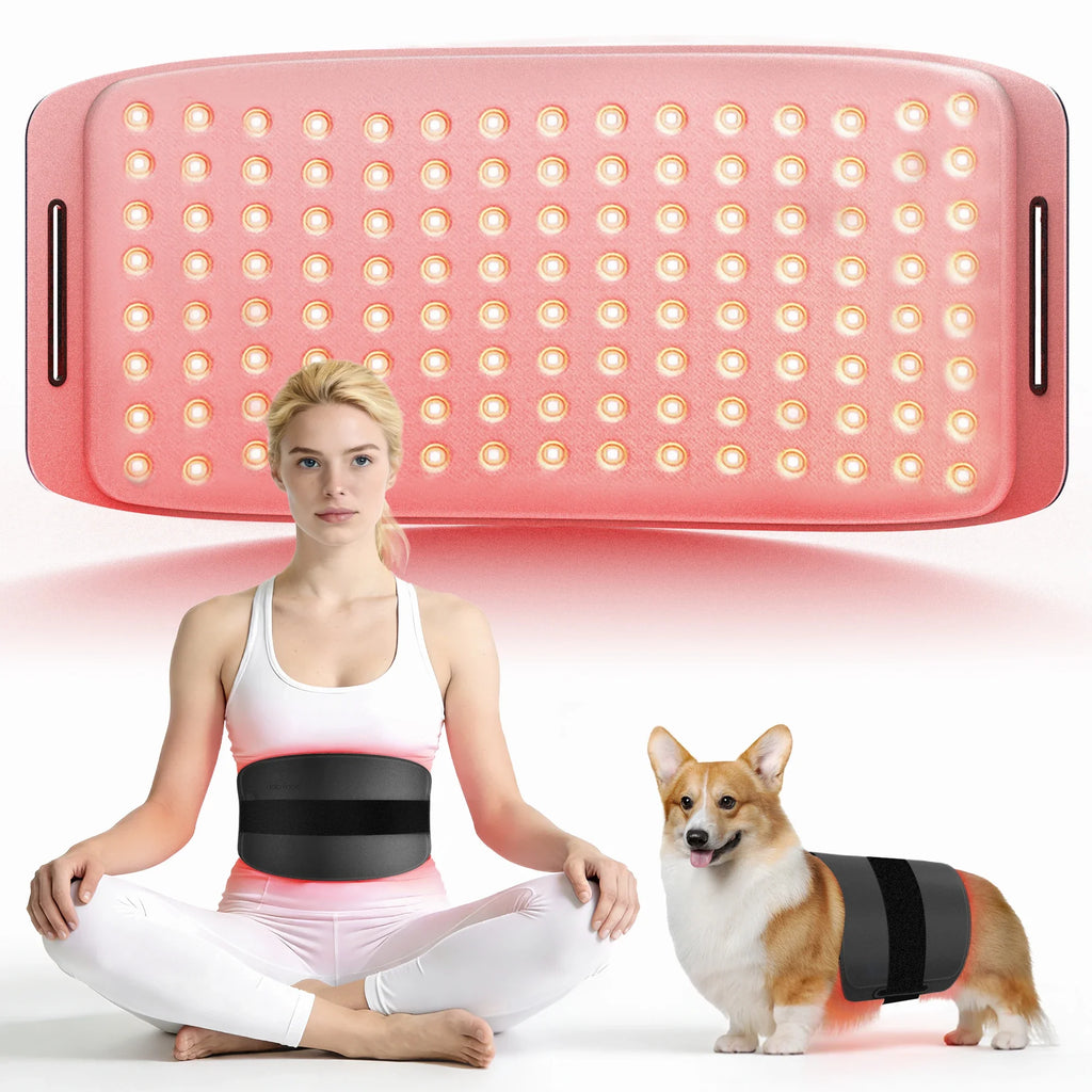 Large pink red light therapy mat with many LEDs, shown wrapped around a woman's waist and a Corgi dog.