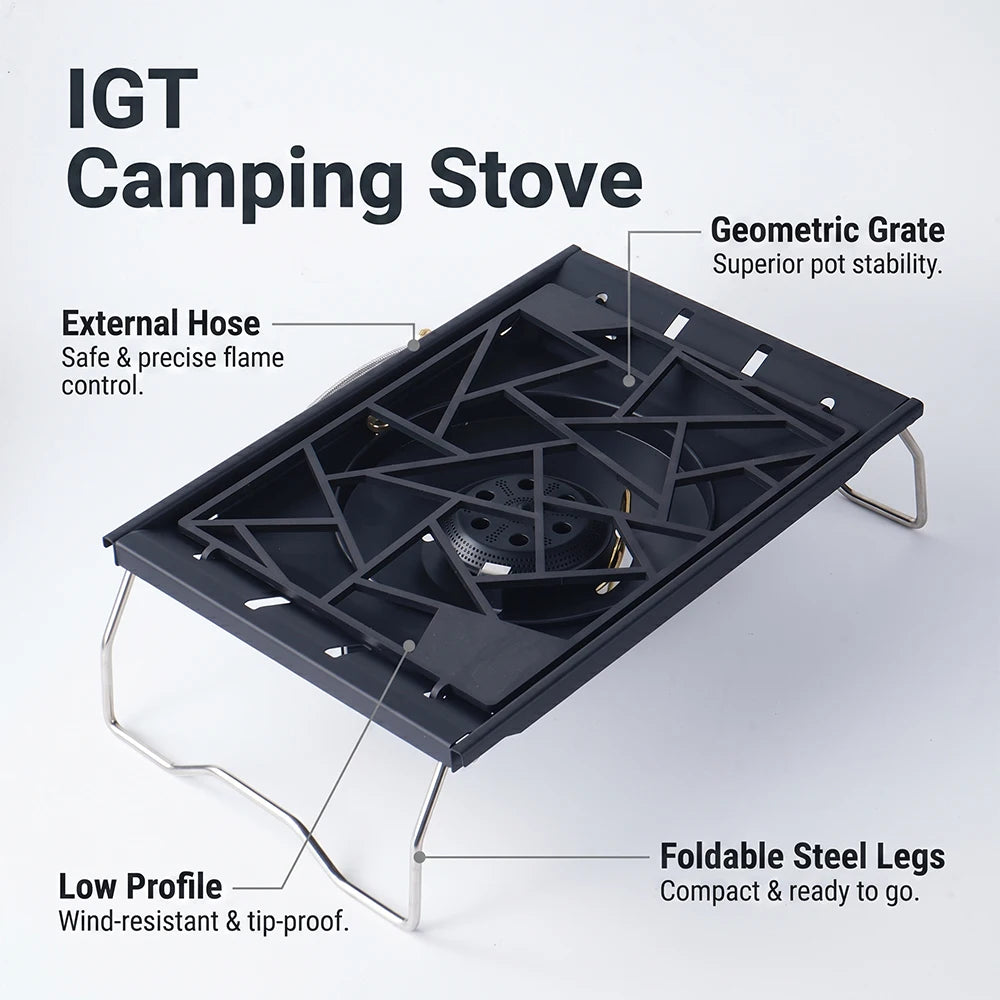 Portable camping stove with black grate and foldable steel legs, external hose burner
