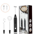 Black USB rechargeable handheld milk frother with three stainless steel whisk attachments and charging cable.