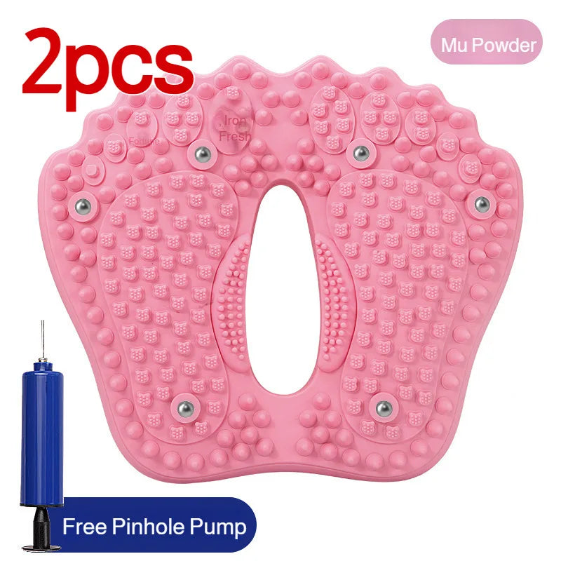 Pink, foot-shaped inflatable acupoint massage mat with embedded magnetic stones and a handheld pump.